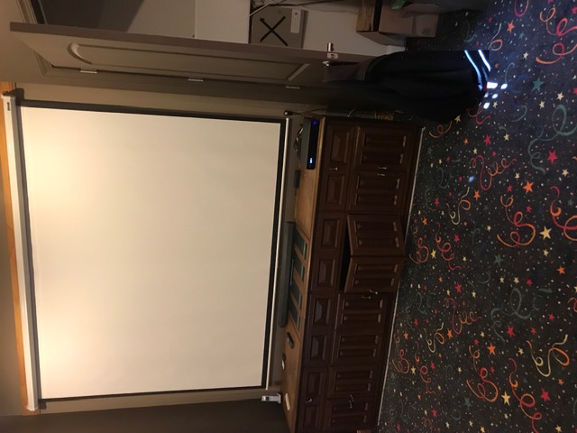 Projector screen in basement entertainment room in South Jersey