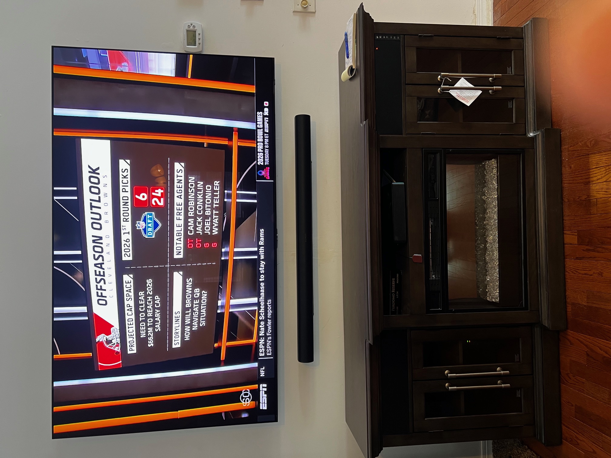 TV and soundbar mounted next to entertainment unit in NJ